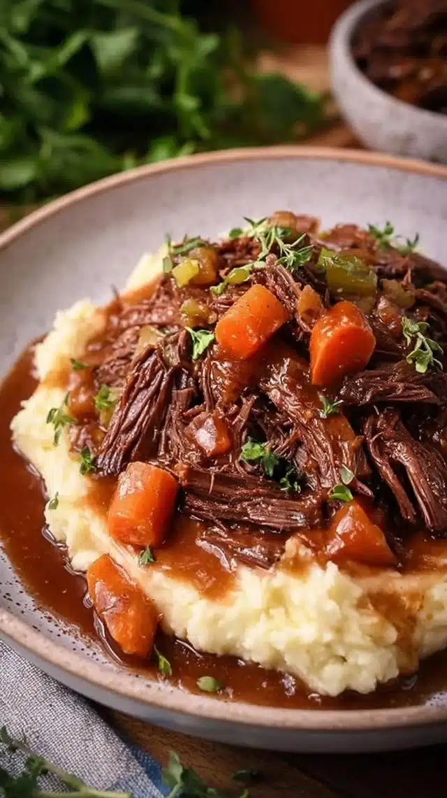 Balsamic Slow Cooker Pot Roast served with vegetables and herbs