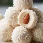 Delicious easy coconut almond truffles made with chocolate and coconut flakes.